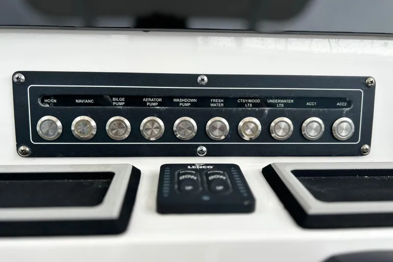 Slide: The Image of Control panel of 2024 Sea Fox 251 Bay Fox boat with labeled switches and buttons. - 59