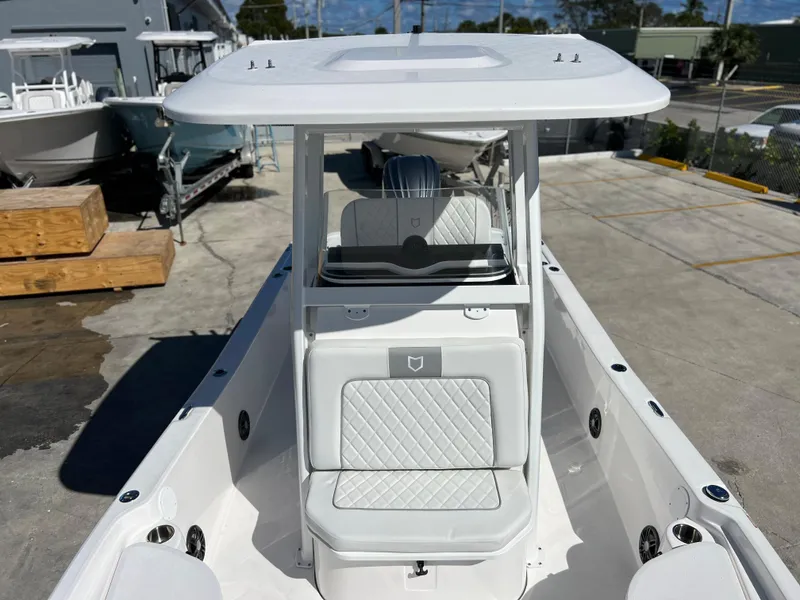 Slide: The Image of 2024 Sea Fox 251 Bay Fox boat in a marina, front view. - 9
