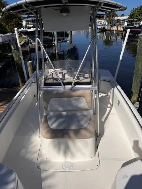 Slide: The Image of 2007 Scout 220 Bay Scout boat docked at a marina. - 3