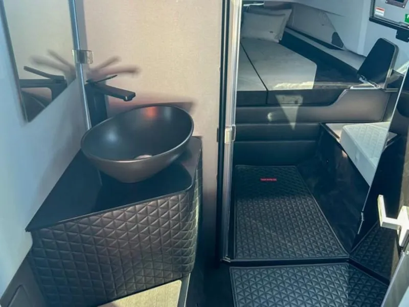 Slide: The Image of Luxurious interior of 2024 BRABUS Shadow 900XC with modern sink and sleek design. - 11