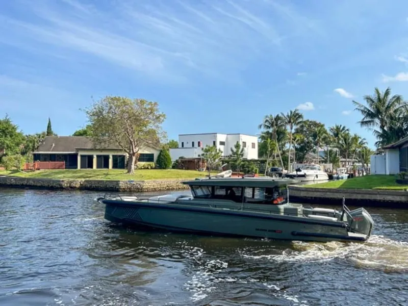 Slide: The Image of 2024 BRABUS Shadow 900XC cruising on a scenic waterway. - 4