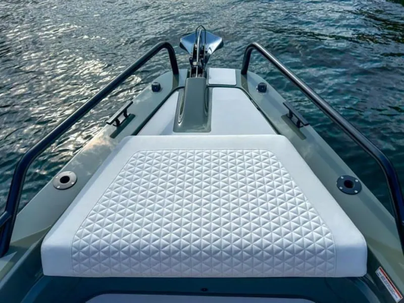 Slide: The Image of 2024 BRABUS Shadow 900XC boat bow with quilted seating on water. - 5
