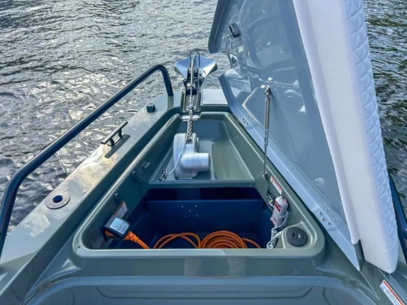 Slide: The Image of 2024 BRABUS Shadow 900XC boat anchor compartment open on water. - 6