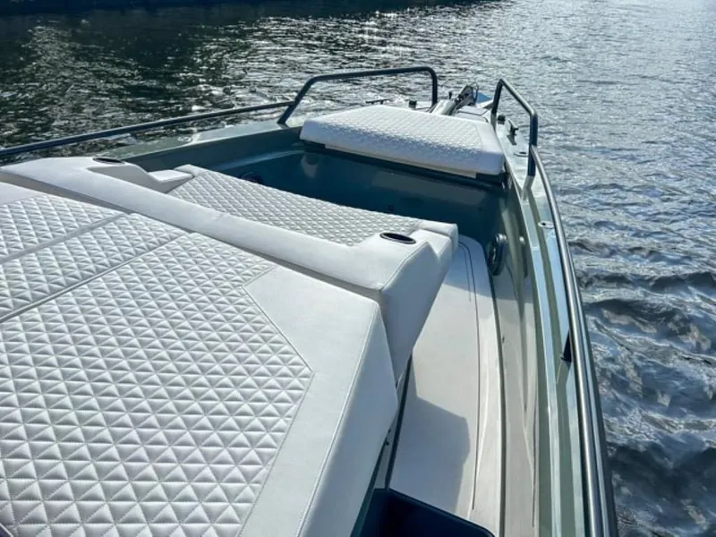 Slide: The Image of 2024 BRABUS Shadow 900XC luxury boat with quilted seating on water. - 7