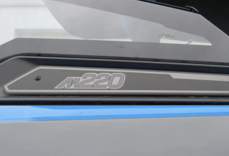 Slide: The Image of 2023 Malibu M220 boat model badge close-up. - 2