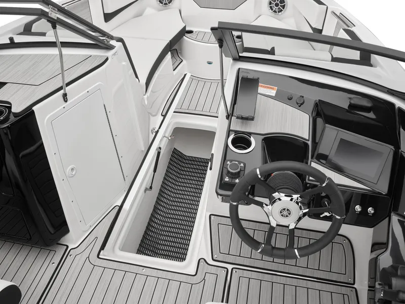 Slide: The Image of 2024 Yamaha Boats 222S cockpit with steering wheel, storage, and control panel. - 3