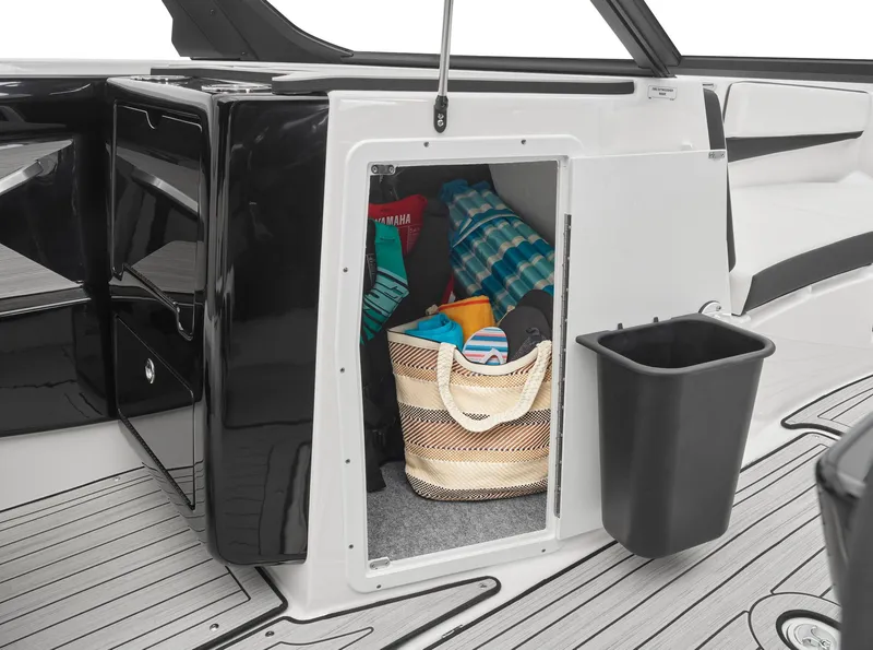 Slide: The Image of 2024 Yamaha Boats 222S storage compartment with beach gear. - 5