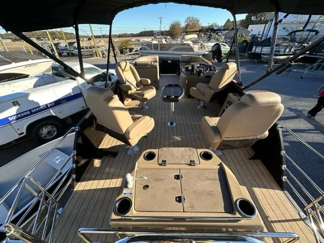 Slide: The Image of 2024 Starcraft EXS-3 HB4 pontoon boat interior with seating and helm station. - 3