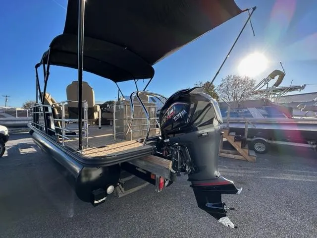 Slide: The Image of 2024 Starcraft EXS-3 HB4 pontoon boat with outboard motor in a marina. - 6