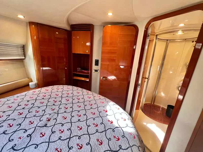 Slide: The Image of Luxurious cabin interior of a 2004 Azimut 55E yacht with elegant wood finishes. - 38