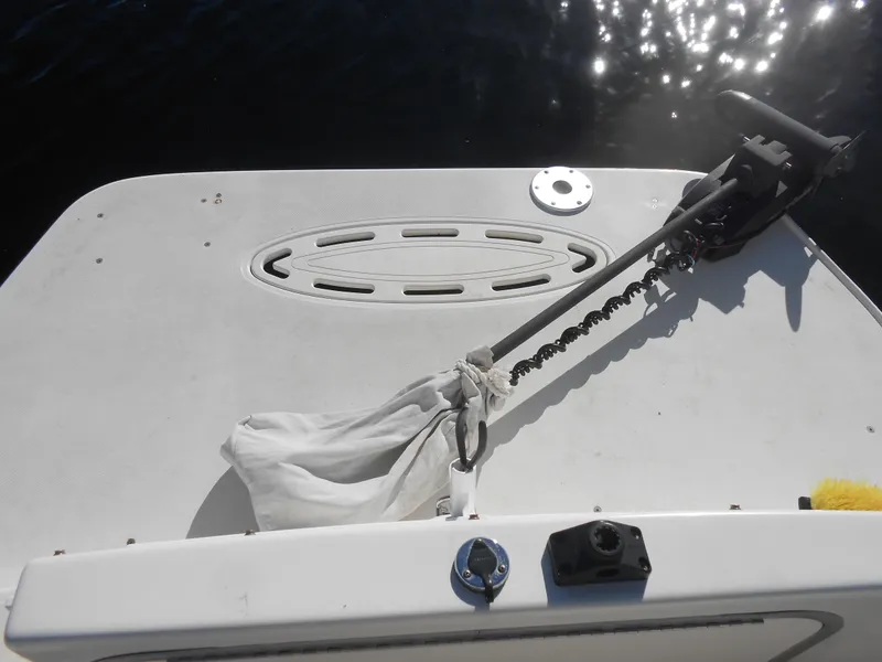 Slide: The Image of 2003 Glastron GS249 boat deck with anchor and motor. - 13