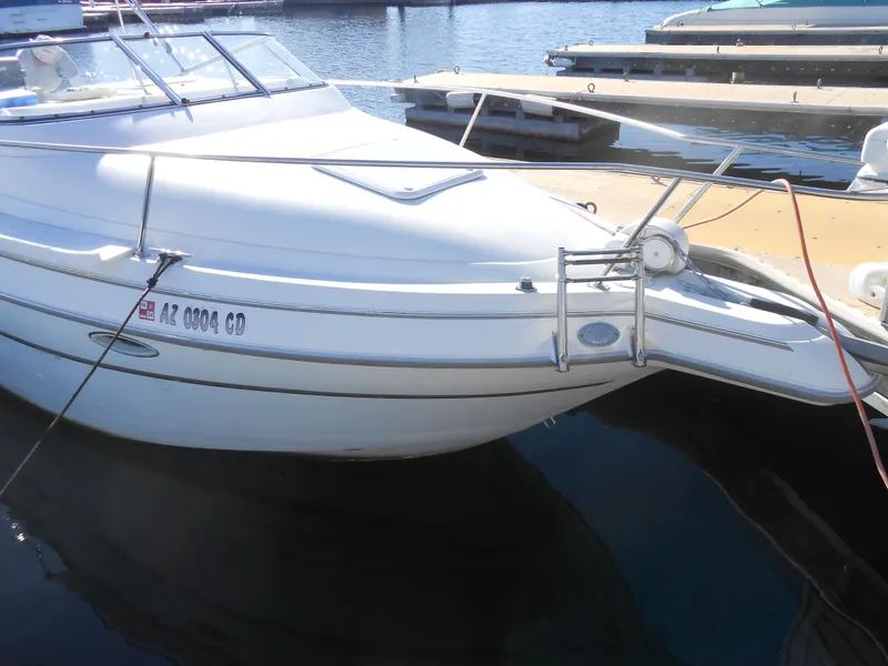 Slide: The Image of 2003 Glastron GS249 boat docked at marina. - 2
