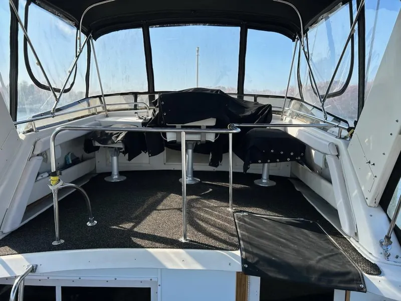 Slide: The Image of 1990 Silverton AFT CABIN boat interior with seating and canopy. - 18