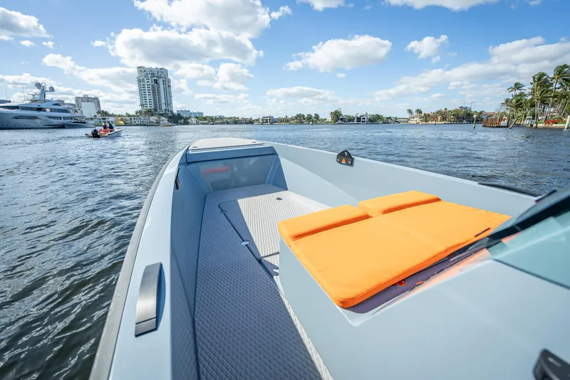 Slide: The Image of 2024 Goldfish 28 Tender boat with orange cushions on a sunny day. - 24