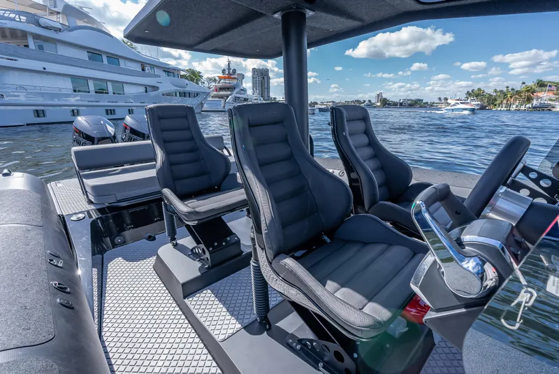 Slide: The Image of Interior of 2024 Goldfish X10 Scout boat with luxury seating and waterfront view. - 14