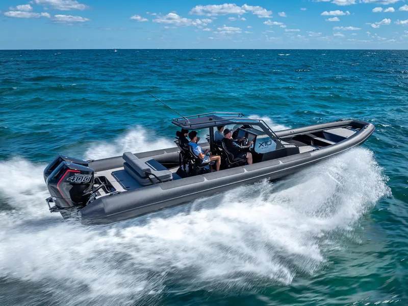 Slide: The Image of 2024 Goldfish X10 Scout boat cruising on the ocean. - 4