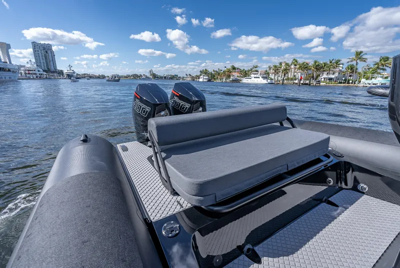 Slide: The Image of 2024 Goldfish X10 Scout boat with twin engines on a sunny day. - 7