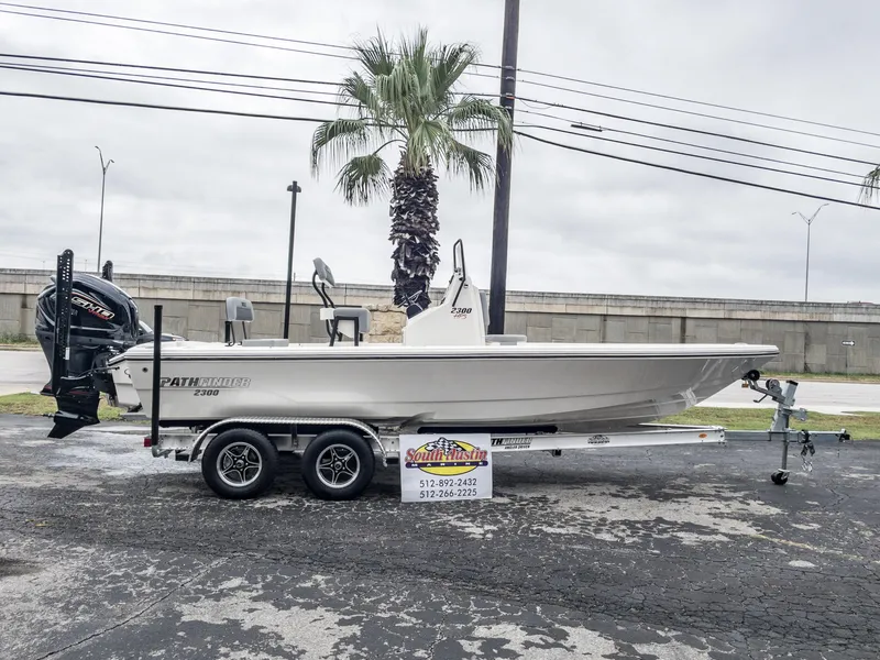 The Image of 2024 Pathfinder 2300 HPS boat on trailer, displayed outdoors. - 1