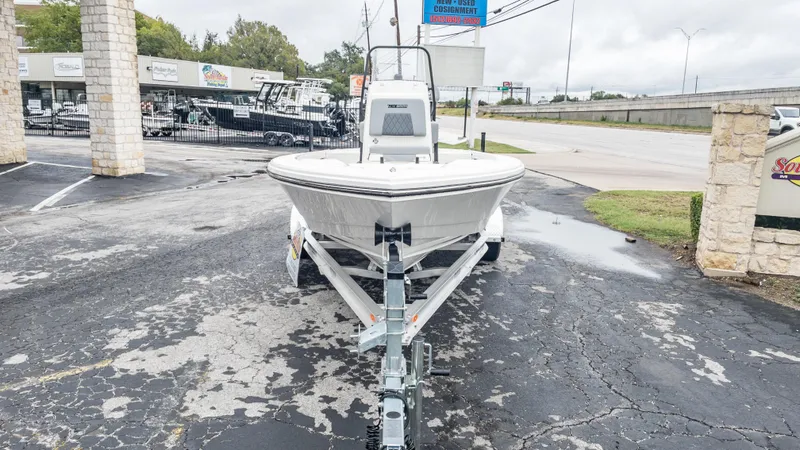Slide: The Image of 2024 Pathfinder 2300 HPS boat on a trailer at a dealership. - 11