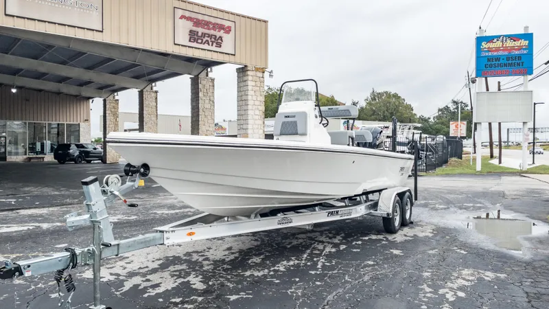 Slide: The Image of 2024 Pathfinder 2300 HPS boat on trailer at dealership. - 12