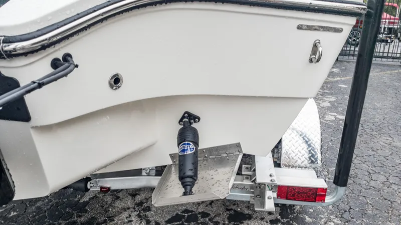 Slide: The Image of Close-up of the 2024 Pathfinder 2300 HPS boat's transom and trailer. - 14