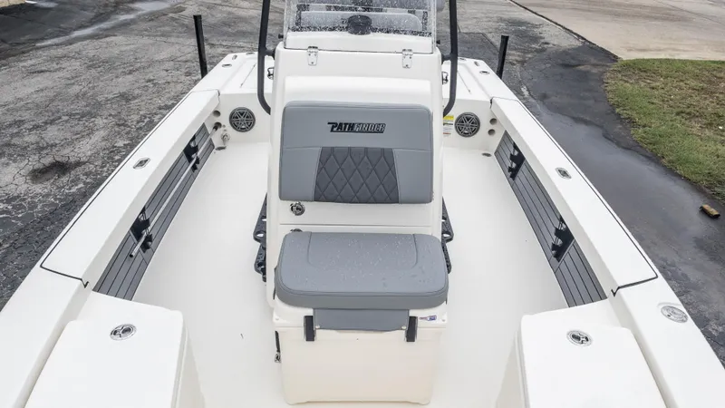 Slide: The Image of 2024 Pathfinder 2300 HPS boat interior with seating and storage compartments. - 21