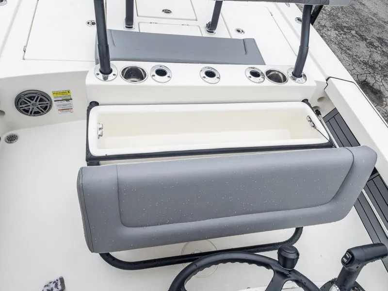 Slide: The Image of 2024 Pathfinder 2300 HPS boat interior with storage compartment and rod holders. - 23