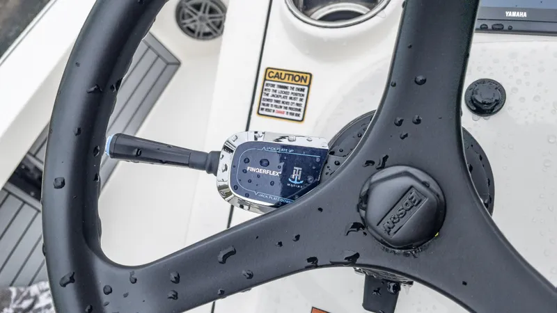 Slide: The Image of Close-up of 2024 Pathfinder 2300 HPS boat steering wheel with FingerFlex control. - 28