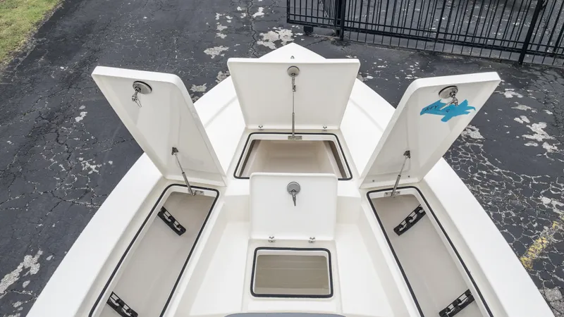 Slide: The Image of 2024 Pathfinder 2300 HPS boat with open storage compartments. - 4