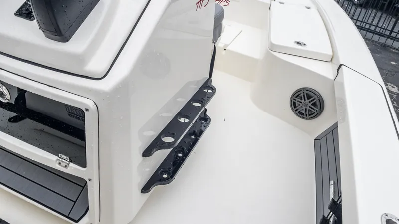Slide: The Image of 2024 Pathfinder 2300 HPS boat interior with rod holders and speaker. - 9