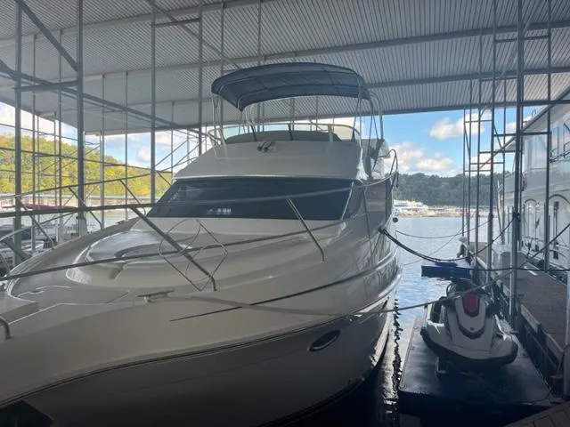 The Image of 2002 Silverton 39 Motor Yacht docked in a covered marina. - 0