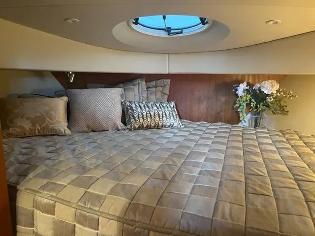 Slide: The Image of Luxurious bedroom in 2002 Silverton 39 Motor Yacht with elegant bedding and floral decor. - 17
