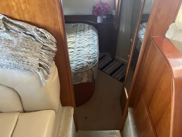 Slide: The Image of Interior cabin of 2002 Silverton 39 Motor Yacht with bed and cozy decor. - 19
