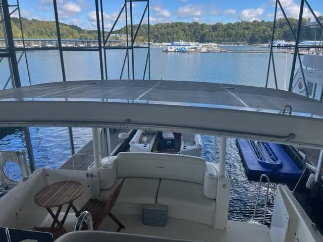 Slide: The Image of 2002 Silverton 39 Motor Yacht docked with scenic lake view. - 21