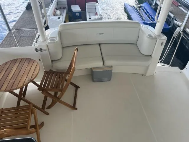 Slide: The Image of 2002 Silverton 39 Motor Yacht deck with seating and table. - 24
