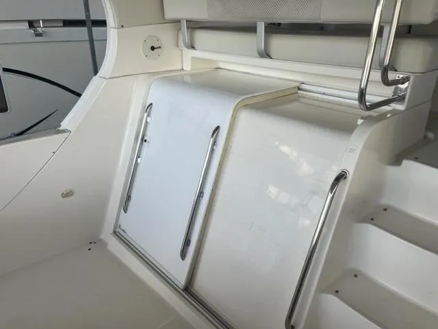 Slide: The Image of 2002 Silverton 39 Motor Yacht interior, white seating and storage area. - 26