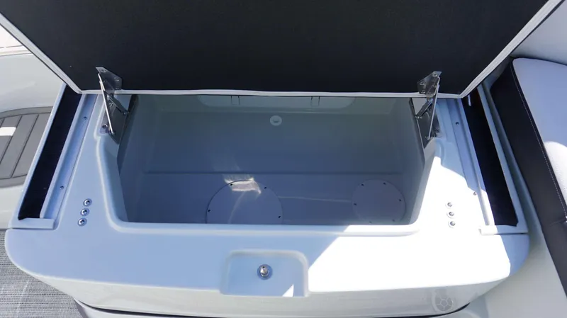 Slide: The Image of Open storage compartment on 2024 Crownline 290 XSS boat. - 15