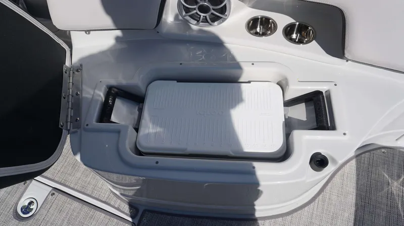 Slide: The Image of Built-in cooler compartment on the 2024 Crownline 290 XSS boat. - 16