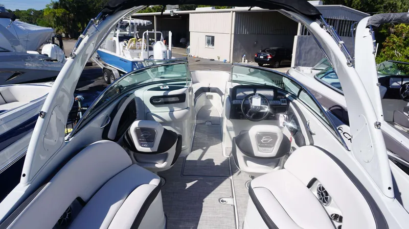 Slide: The Image of 2024 Crownline 290 XSS boat interior with modern seating and dashboard. - 18