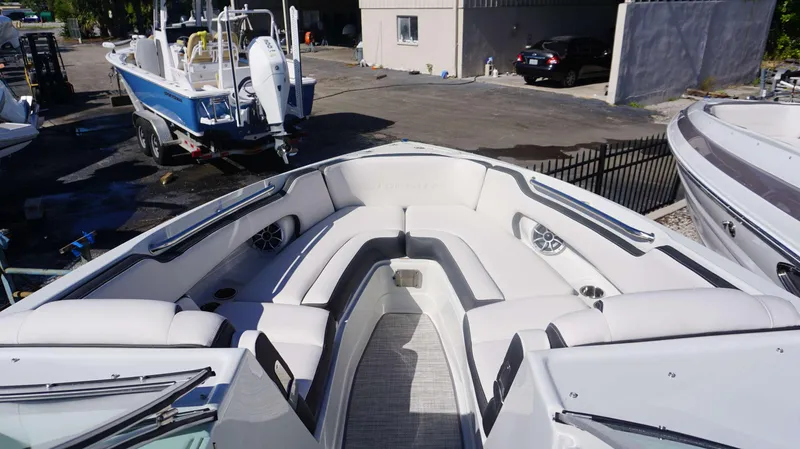 Slide: The Image of 2024 Crownline 290 XSS boat interior with white seating and modern design. - 19
