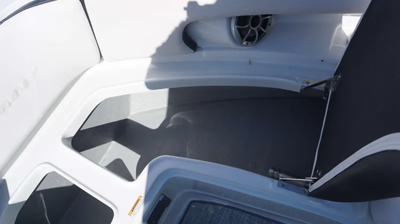 Slide: The Image of 2024 Crownline 290 XSS boat interior storage compartments and speaker. - 5
