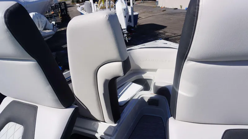 Slide: The Image of 2024 Crownline 290 XSS boat interior seating and storage area. - 7