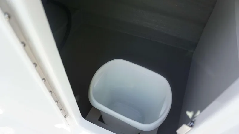 Slide: The Image of Trash bin compartment in 2024 Crownline 290 XSS boat. - 9
