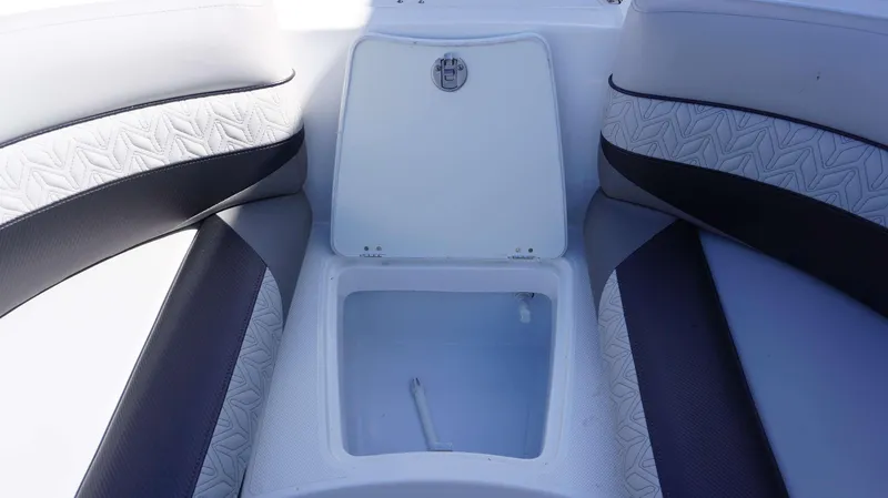 Slide: The Image of 2024 Hurricane 2690 SD boat storage compartment with cushioned seating. - 15