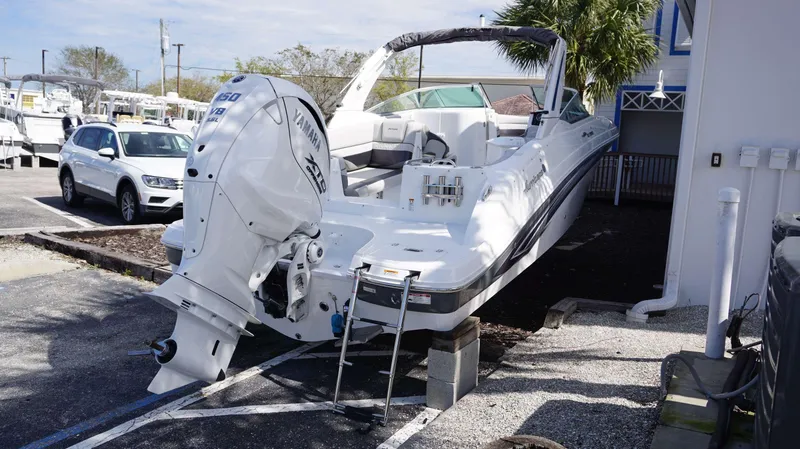 Slide: The Image of 2024 Hurricane 2690 SD boat with Yamaha V8 engine in a parking lot. - 16