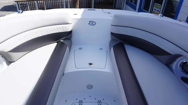 Slide: The Image of 2024 Hurricane 2690 SD boat interior with cushioned seating and storage compartments. - 21