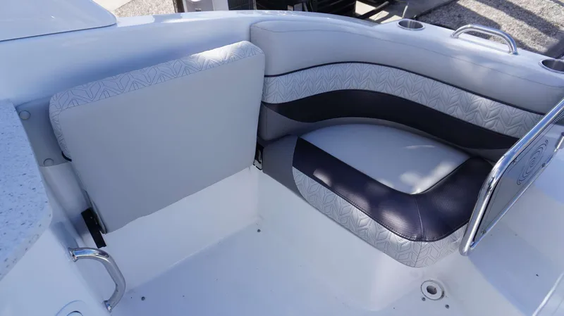 Slide: The Image of 2024 Hurricane 2690 SD boat seating area with cushioned seats and cup holders. - 4