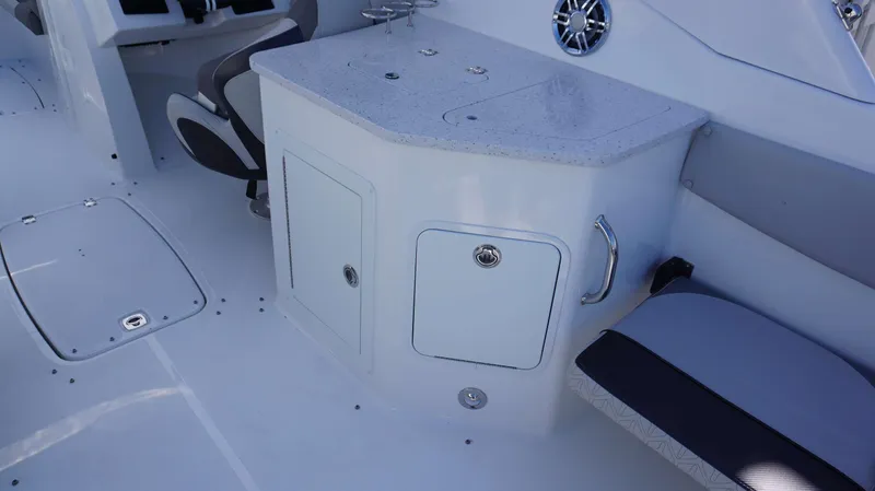 Slide: The Image of 2024 Hurricane 2690 SD boat interior with seating and storage compartments. - 6
