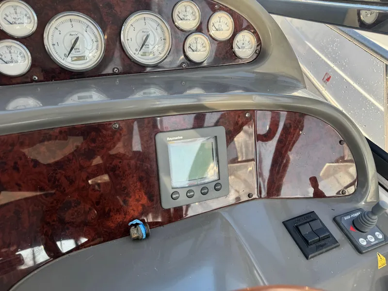 Slide: The Image of 2007 Regal 4060 COMMODORE dashboard with gauges and navigation system. - 12