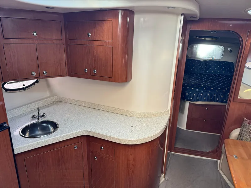 Slide: The Image of 2007 Regal 4060 COMMODORE yacht interior with kitchenette and sleeping area. - 16